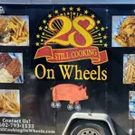 28 Still Cooking On Wheels  logo