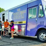 The Purple People Feeder logo