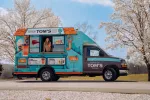 Travelin' Tom's of Greater Austin logo