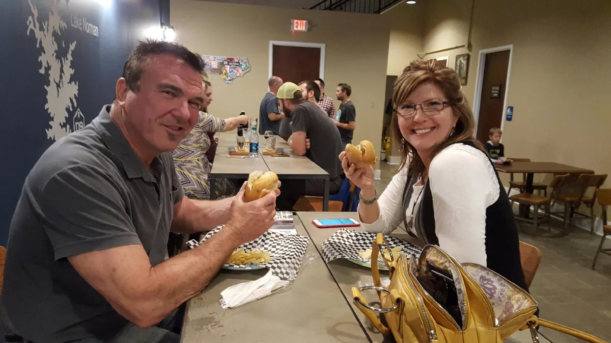 Lovely couple enjoying Chicken Sausage at D9 Brewing Company.